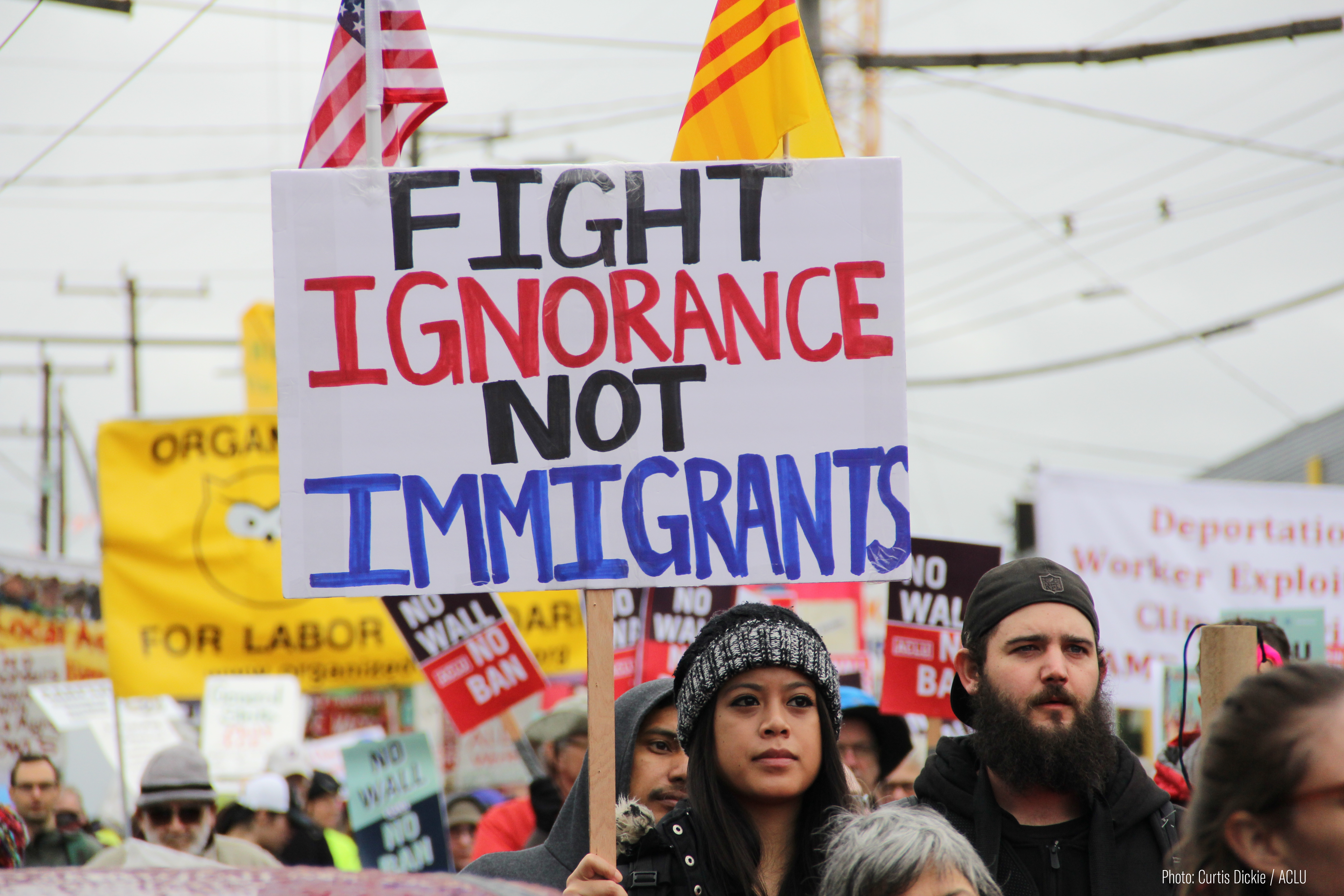 Image: Protest sign that says "Fight Ignorance, Not Immigrants."