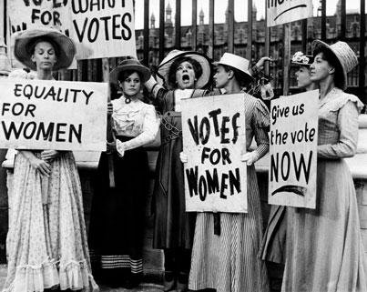 Women's suffrage activists holding signs about voting rights for women